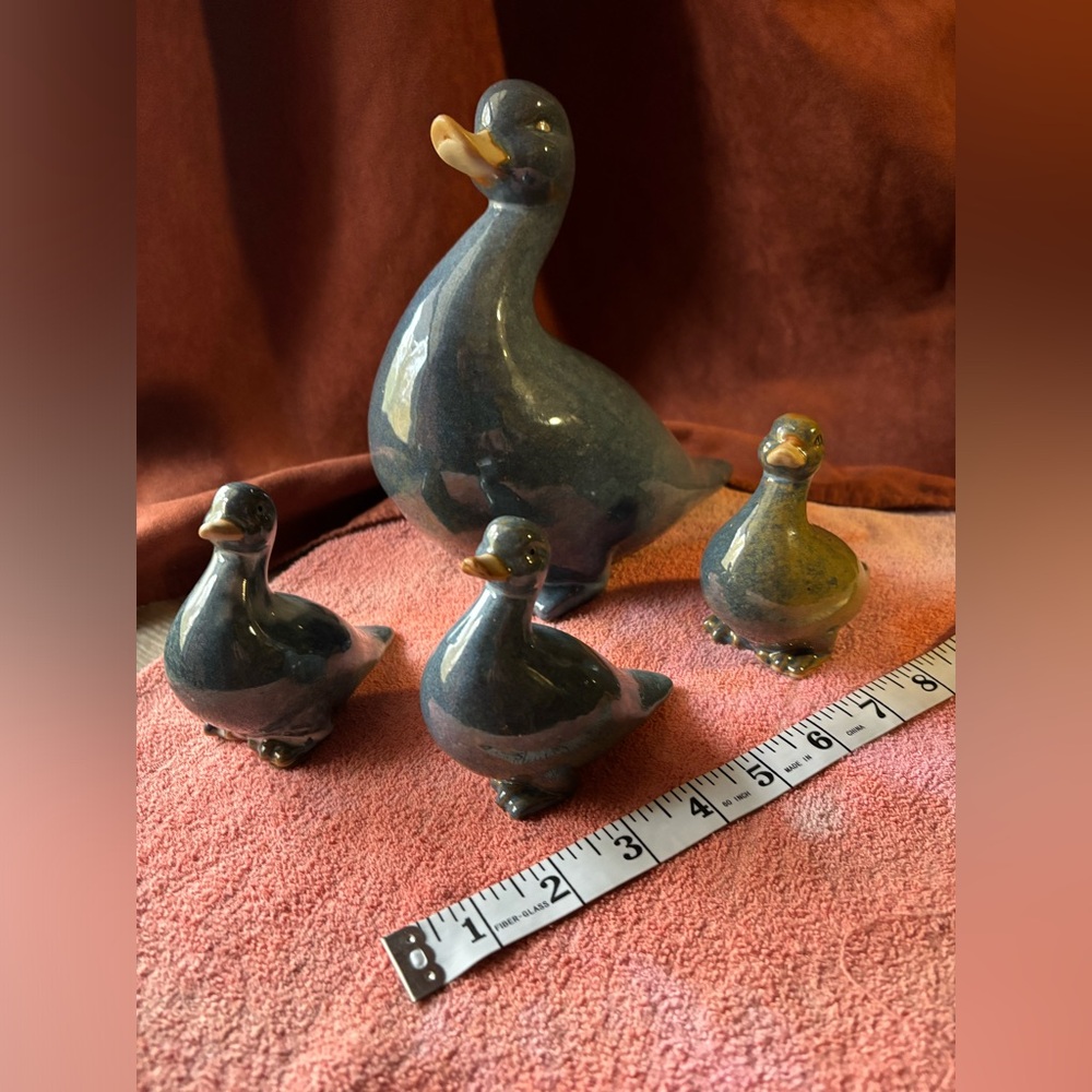 Ceramic duck and three ducklings.